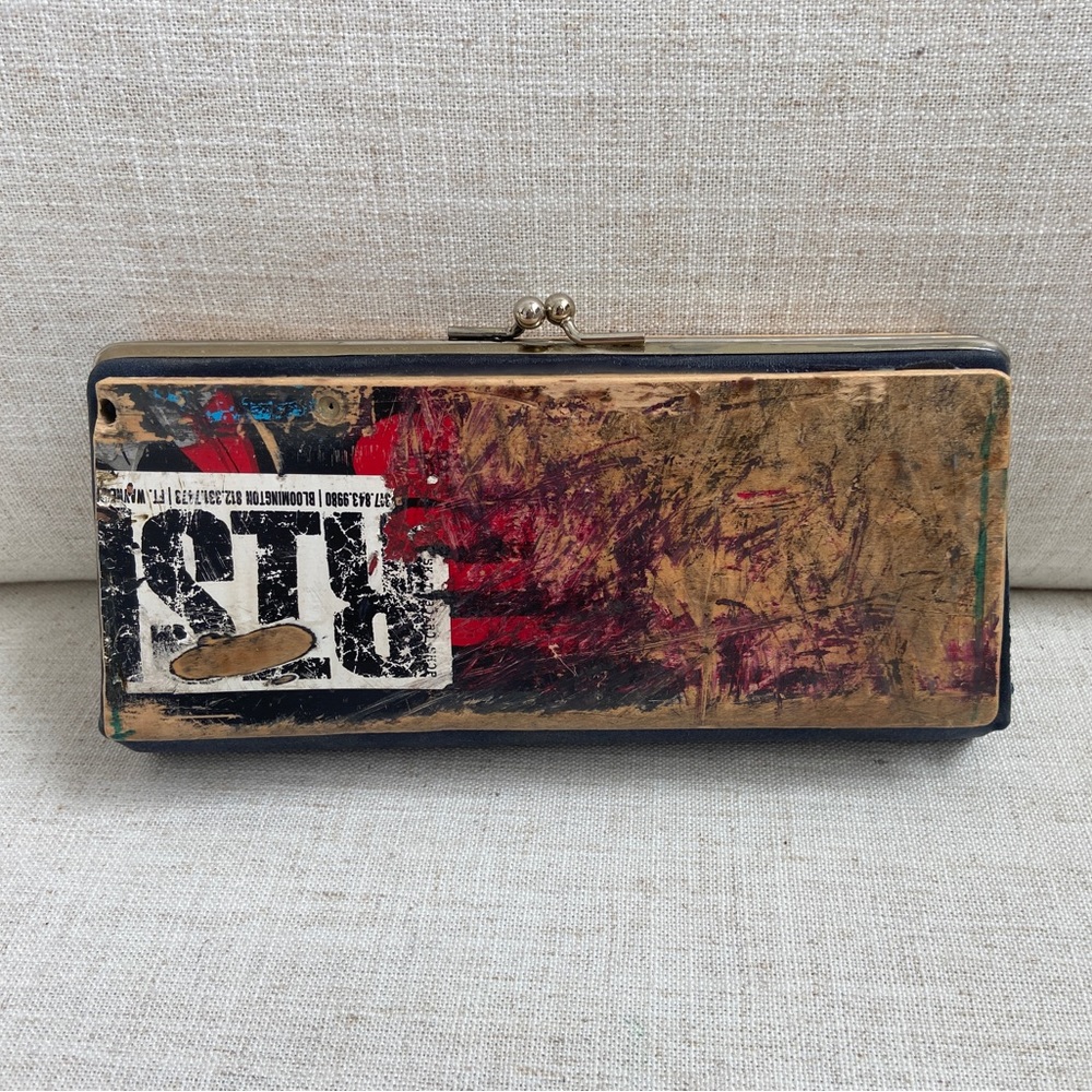 Handmade clutch made from used skateboard